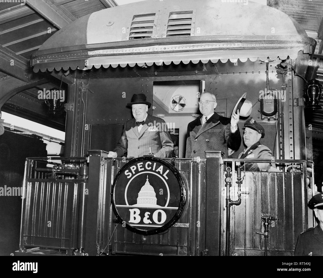 President Harry Truman and Prime Minister Winston Churchill on the rear platform of a train, circa 1945. Stock Photo