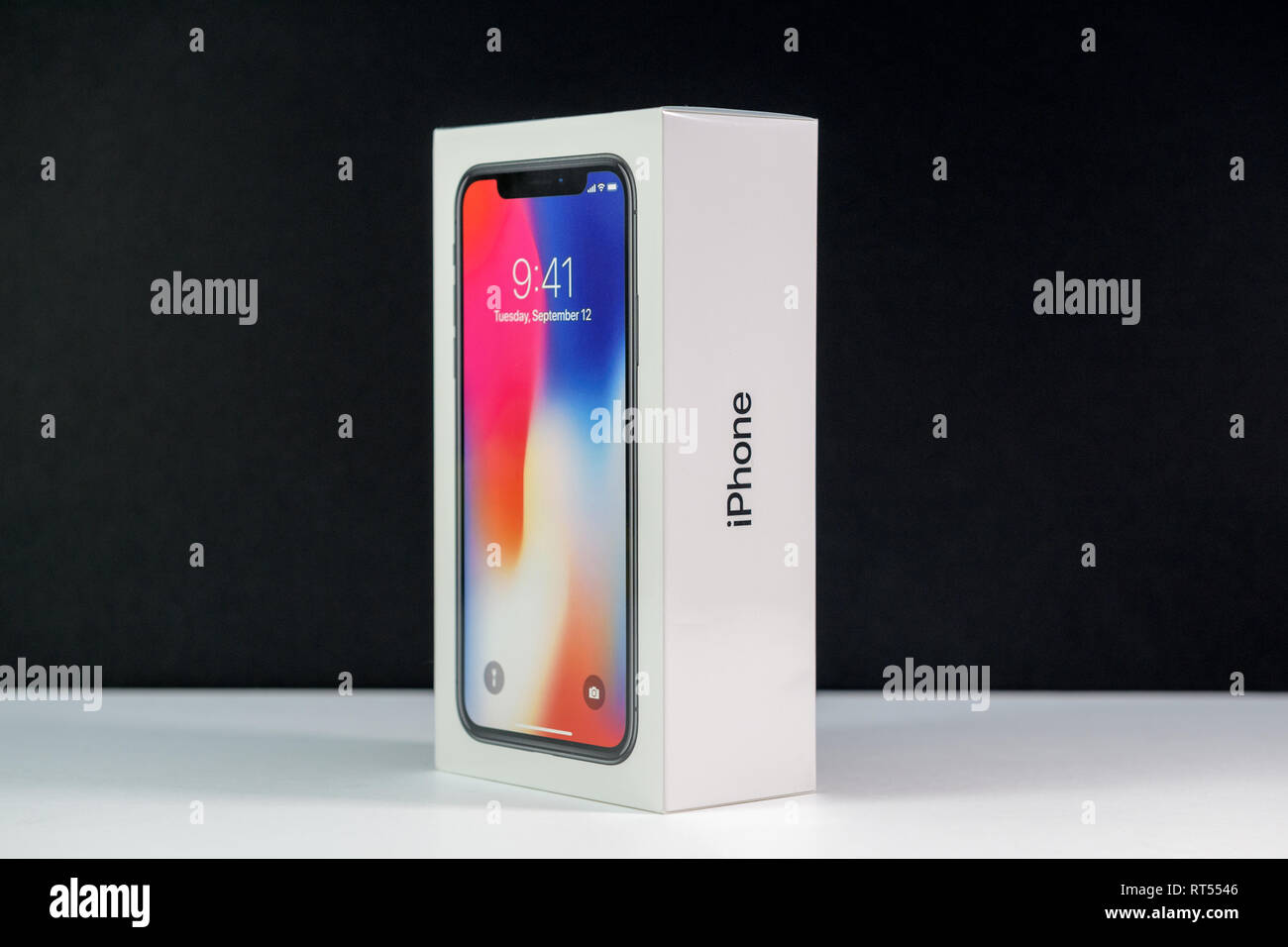 PARIS, FRANCE - NOV 3, 2017: Unboxing unpacking box of the latest Apple iPhone  X 10 smartphone against black background Stock Photo - Alamy