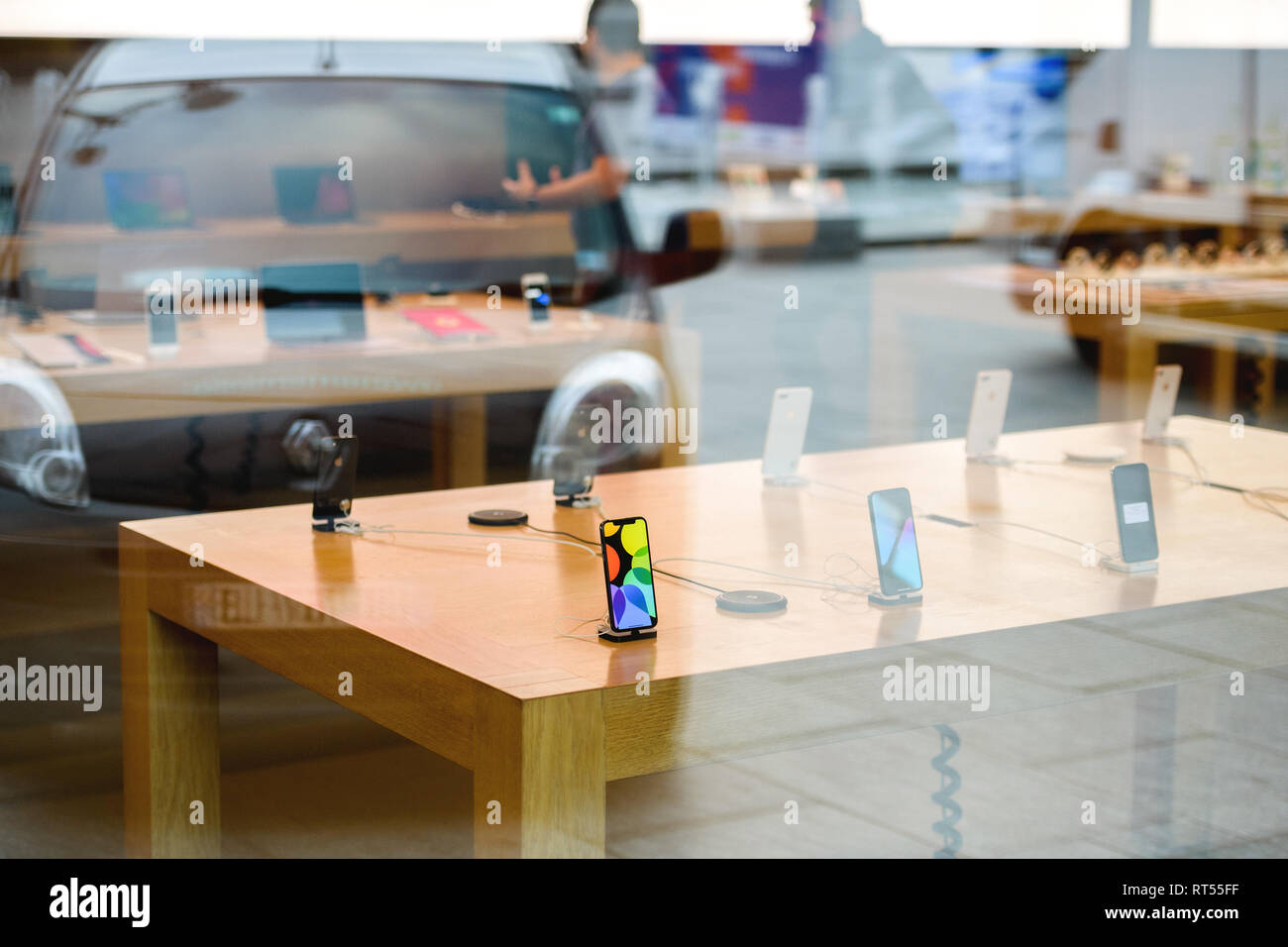 STRASBOURG, FRANCE - NOV 3, 2017: Latest Apple iPhone X and AirPower wireless Charging goes on sale in Apple Store worldwide with phones waiting to be tested by customers  Stock Photo