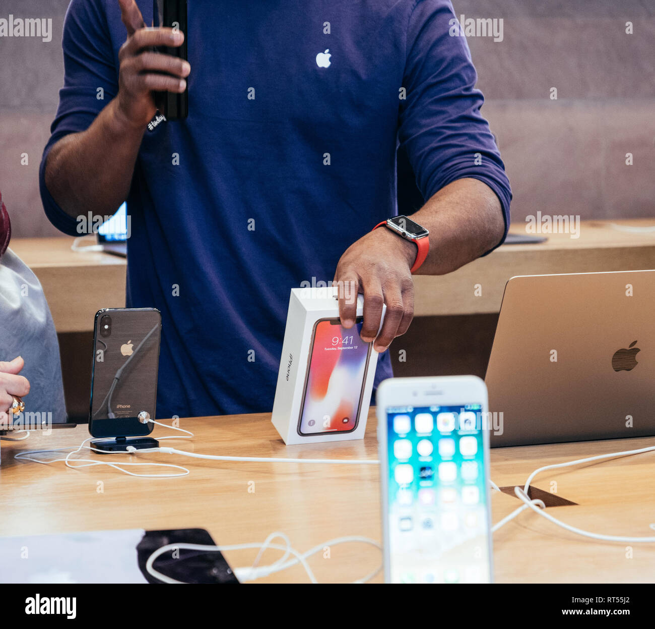 An Apple Store with People Waiting To Purchase Apple Macbooks, IPads and  IPhones Editorial Image - Image of designs, ecosystem: 168250490