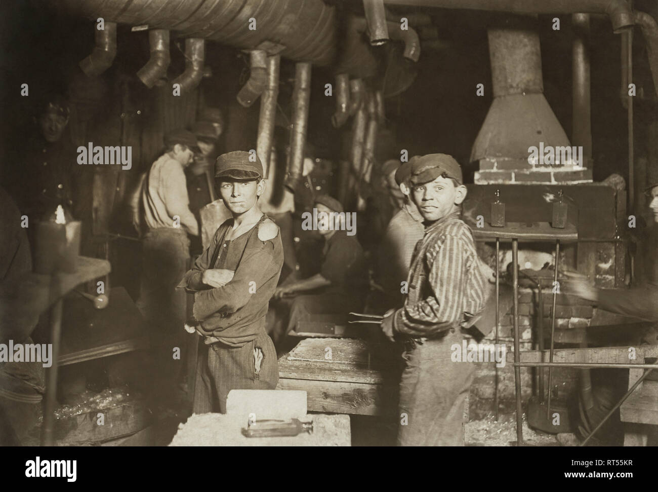 Young child labor workers in a glass factory in Indiana at midnight