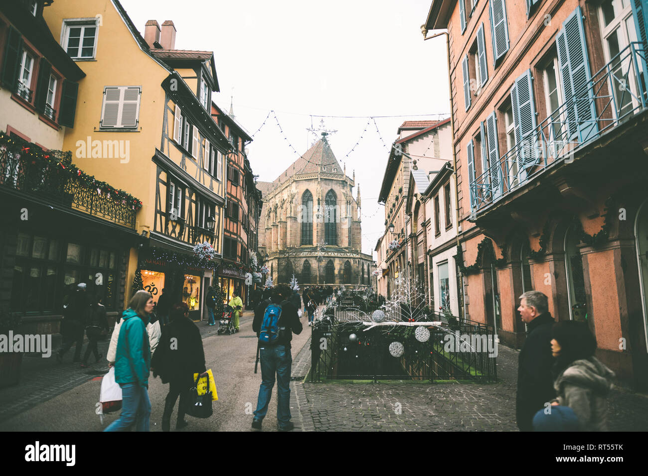 COLMAR FRANCE NOV 23 2014 Tourists admiring the Christmas Market drinking mulled hot spicy wine in central square Stock Photo Alamy