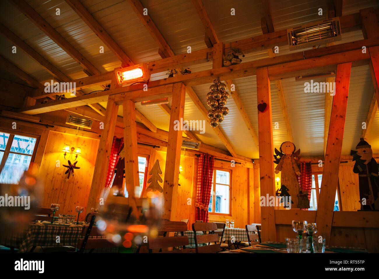 Interior of empty simple restaurant in French village with Christmas decorations for the winter holiday Stock Photo