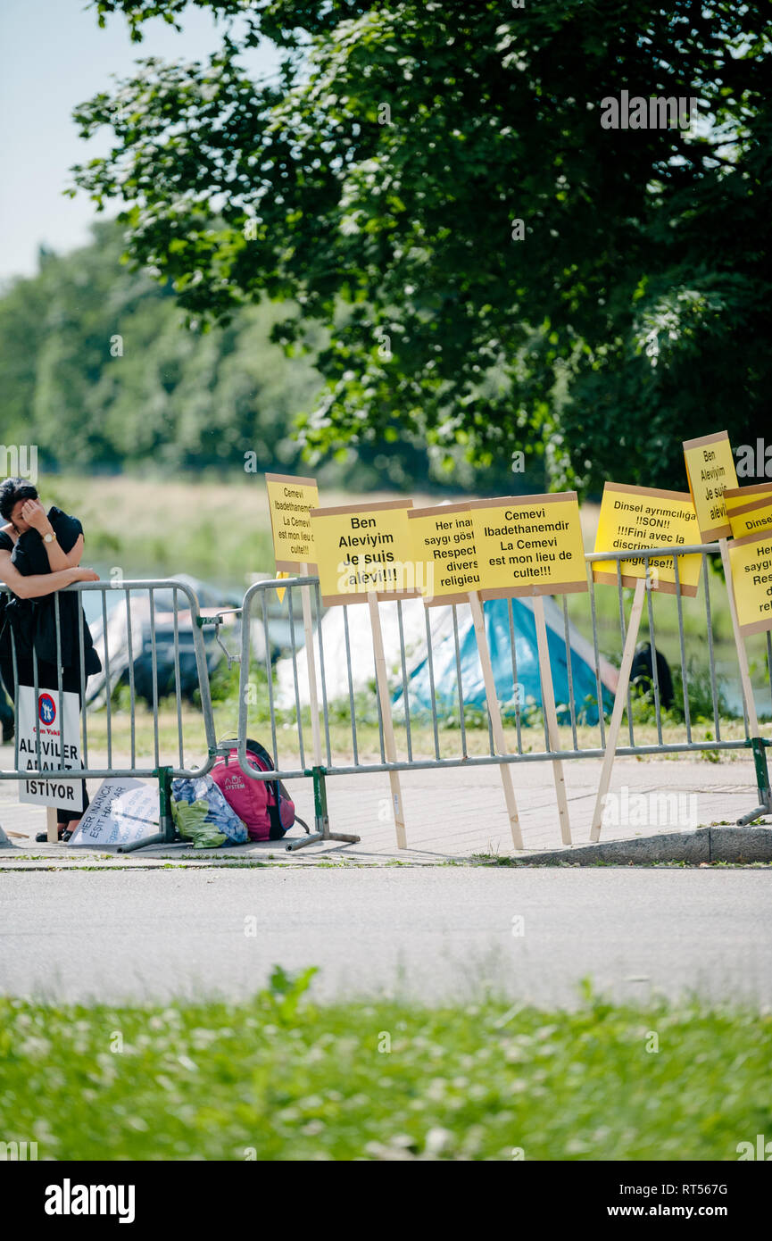 STRASBOURG, FRANCE - JUN 3, 2015: People protesting at European Court of Human Rights ECHR during grand chamber hearing conc rejection made by Turkish Alevis that state cover the expenses of cemevis Stock Photo