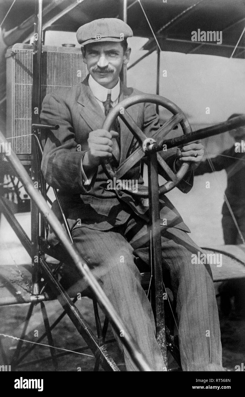 Aviation history photograph of Glenn Curtiss in the pilotâ€™s seat of his biplane. Stock Photo