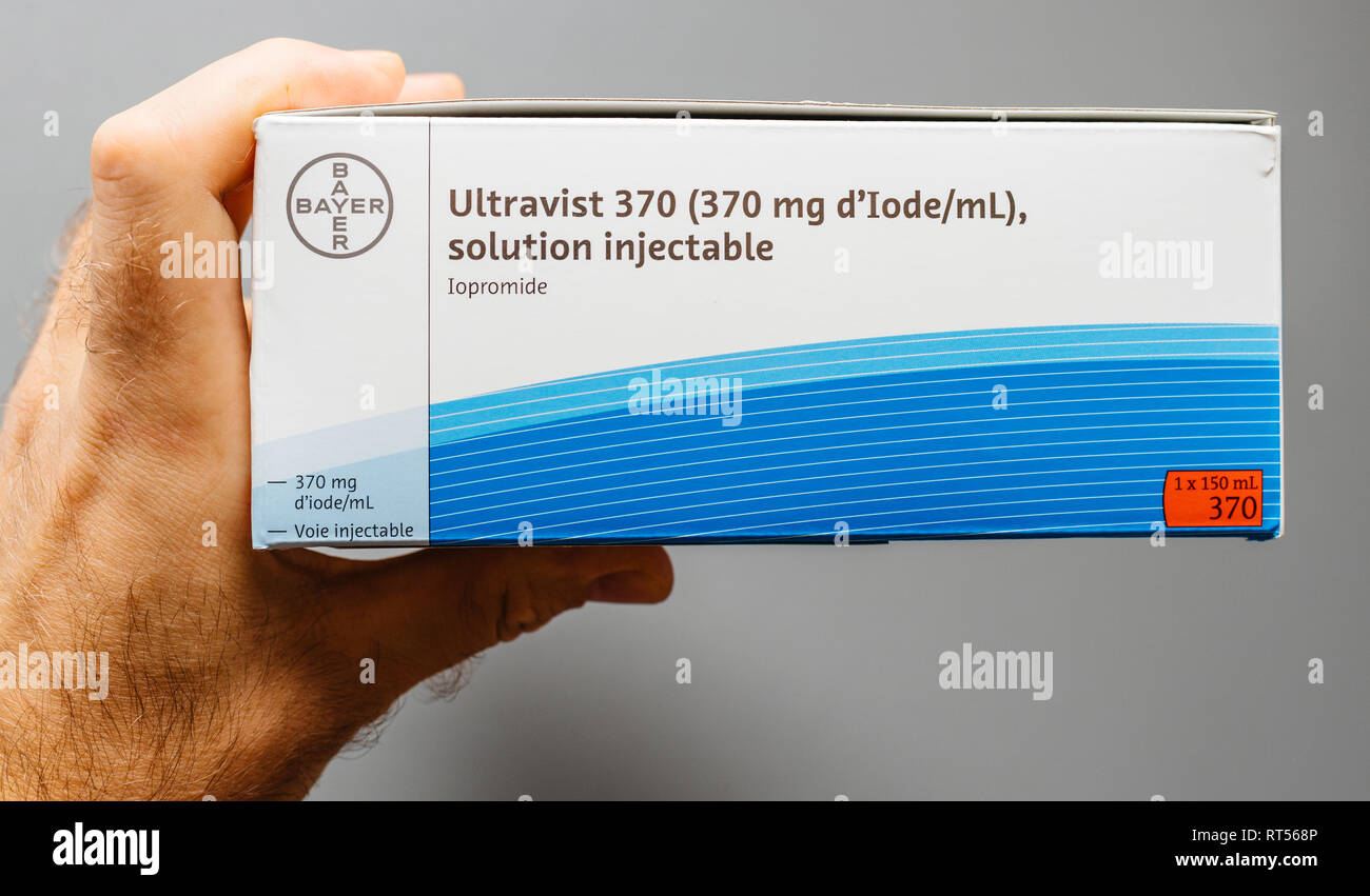 PARIS, FRANCE - NOV 22, 2017: Ultravist - Iopromide package containing the  contrast agent and all the necessary accessories for the medical  intervention under CT scanner doctor holding against gray background Stock  Photo - Alamy