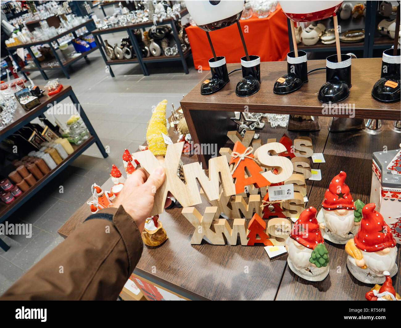 FRANKFURT, GERMANY - NOV 25, 2017: Man buying in German supermarket traditional Christmas decorations Stock Photo