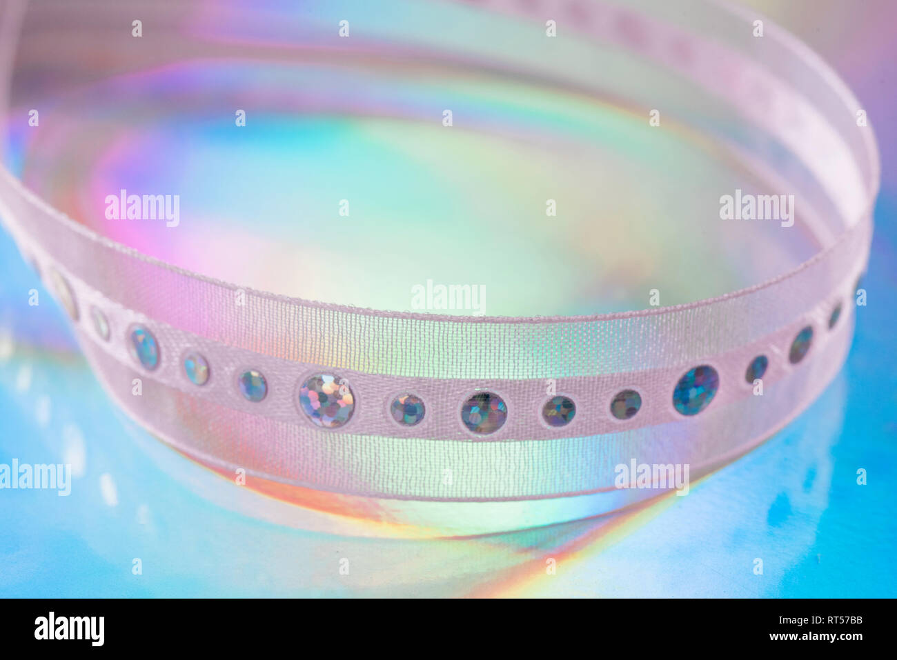 Abstract ribbon on holographic paper Stock Photo