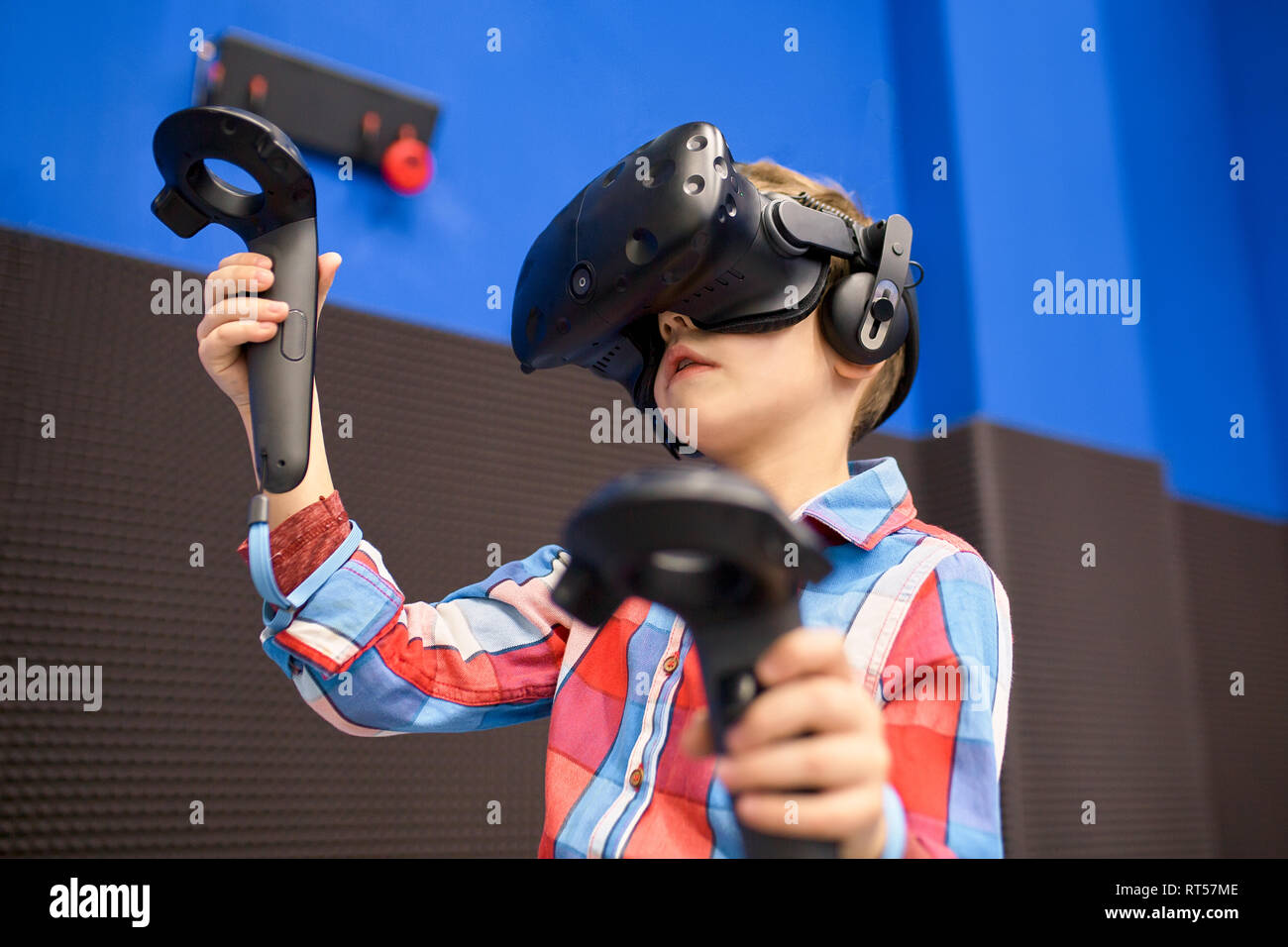 modern technology, gaming and people concept boy in virtual reality