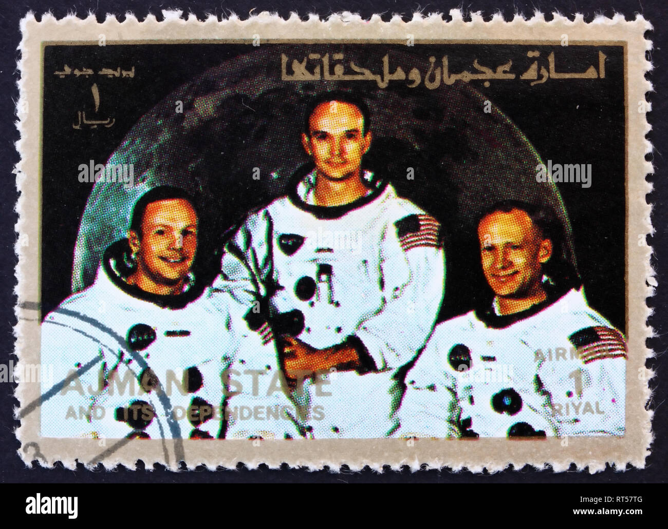 AJMAN - CIRCA 1973: a stamp printed in the Ajman shows Crew of Apollo 11, Neil Armstrong, Buzz Aldrin and Michael Collins, Moon-landing, Apollo 11, ci Stock Photo