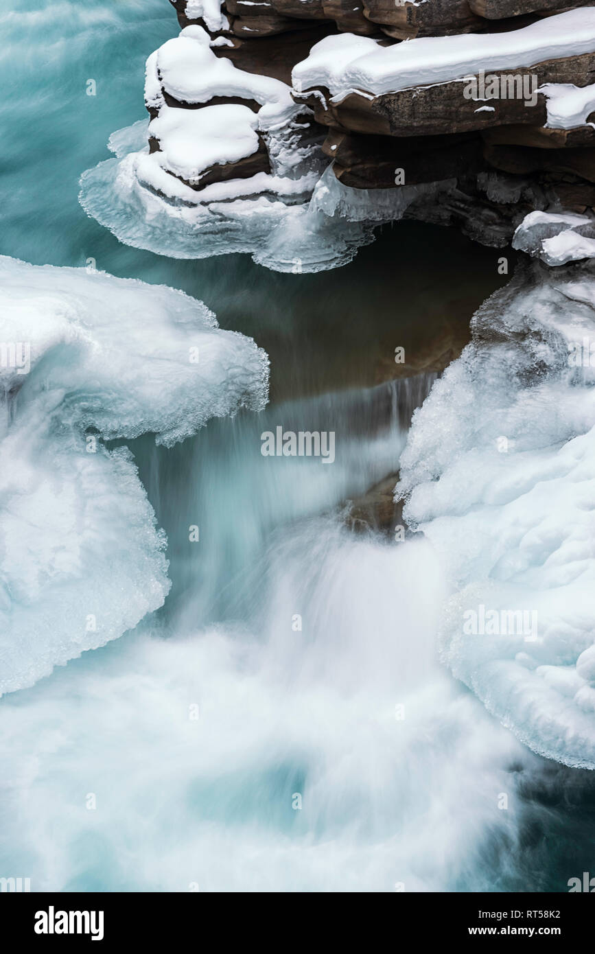 Section of a snow covered and frozen Athabasca Falls on the Athabasca River, Jasper National Park, Canadian Rockies, Alberta, Canada Stock Photo