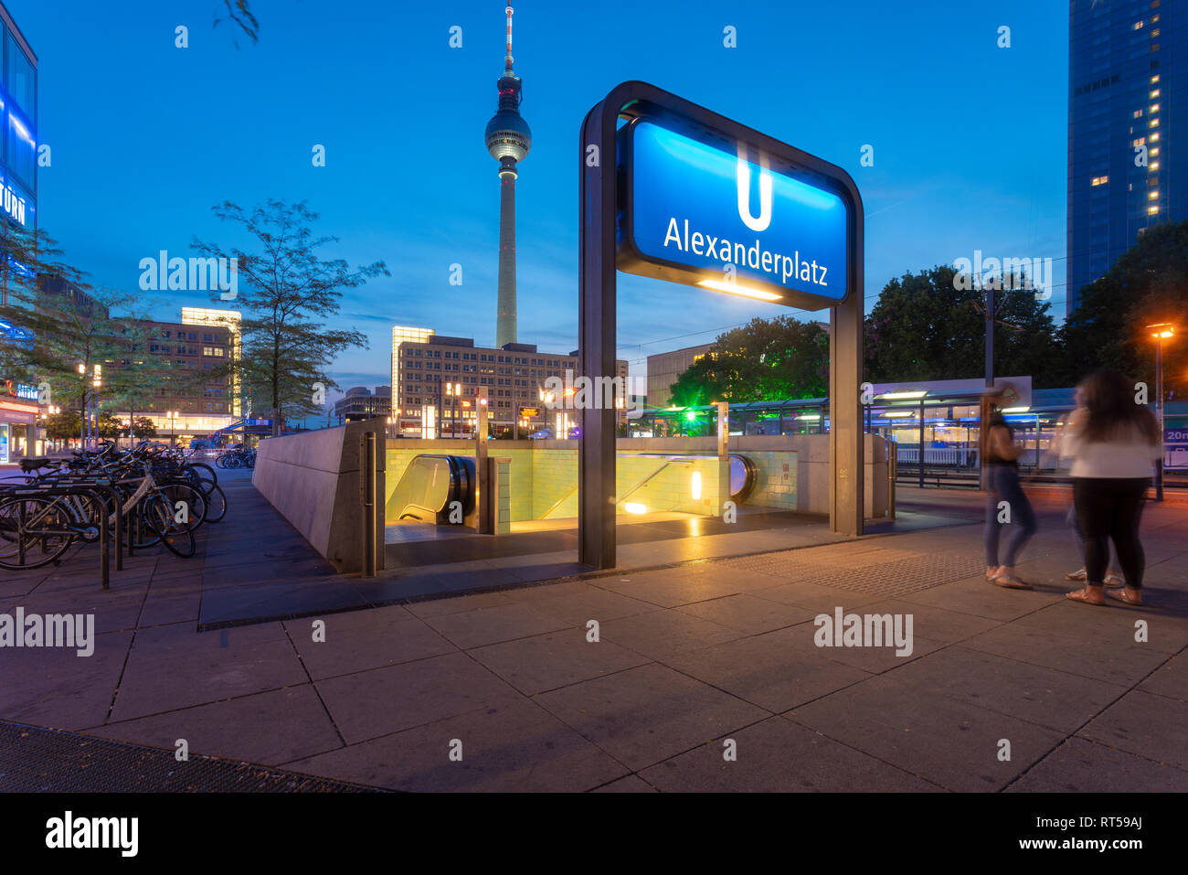 Germany, Berlin, Alexanderplatz, Berlin TV Tower and Underground station Alexanderplatz in the evening Stock Photo