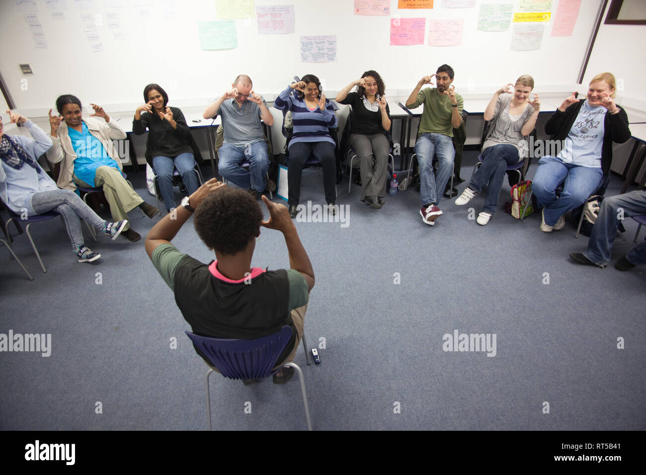 adults in a further education college learning how to use sign language ...