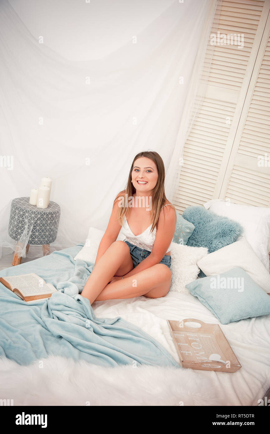 Young woman relaxing at a vintage home Stock Photo