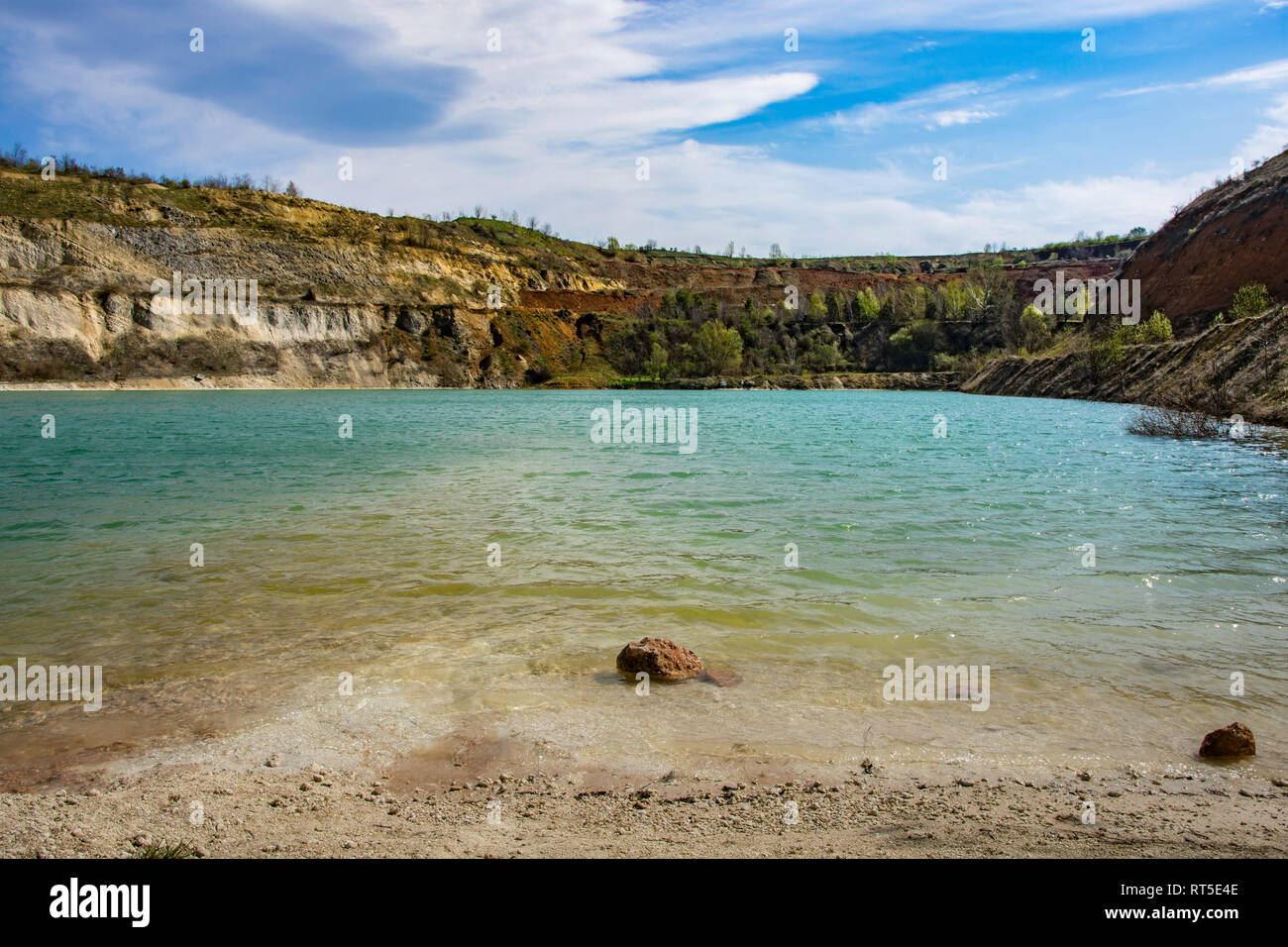 beautiful-lake-ledinci-ledinacko-near-fruska-gora-in-serbia-very-clear-water-that-has-almost-a-green-color-once-there-was-a-stone-pit-RT5E4E.jpg