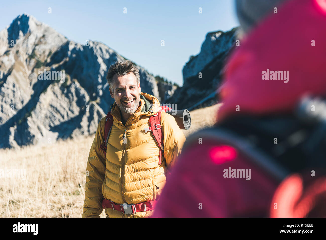 Austria, Tyrol, happy man with woman hiking in the mountains Stock Photo