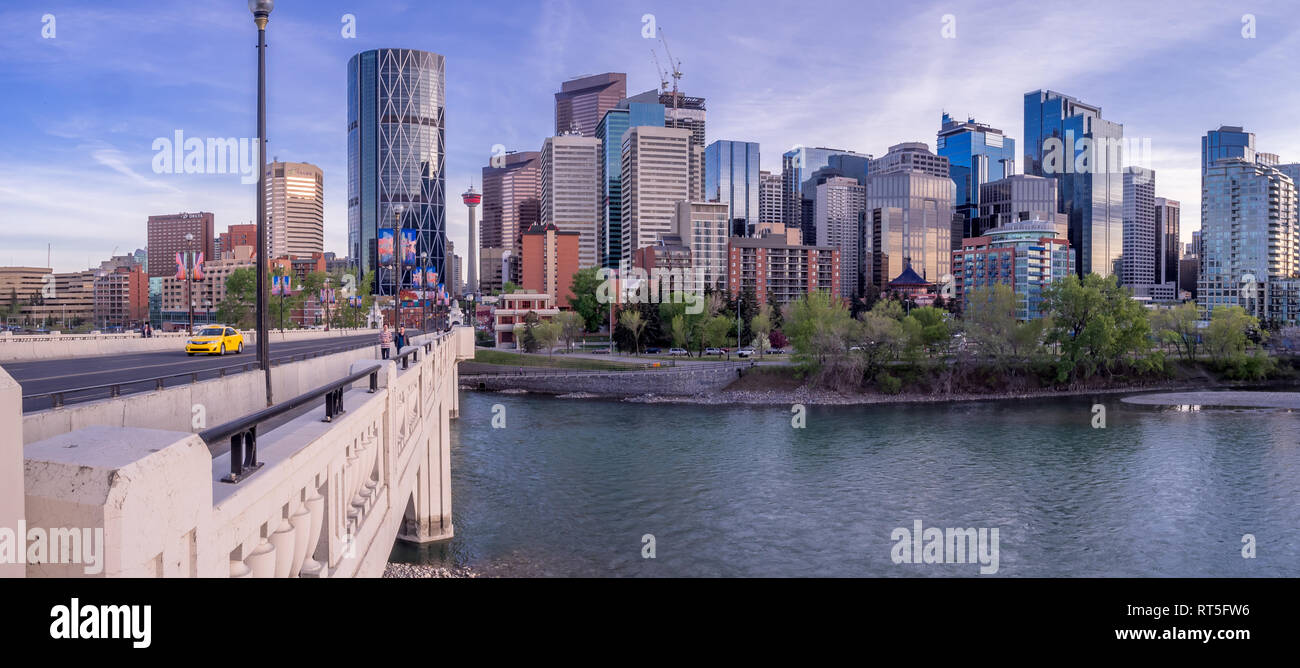 Calgary skyline at night with Bow River and Centre Street Bridge ...