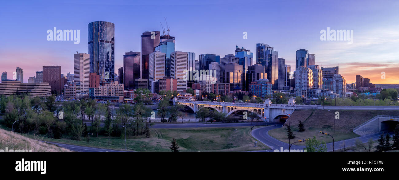 Calgary skyline at night with Bow River and Centre Street Bridge ...