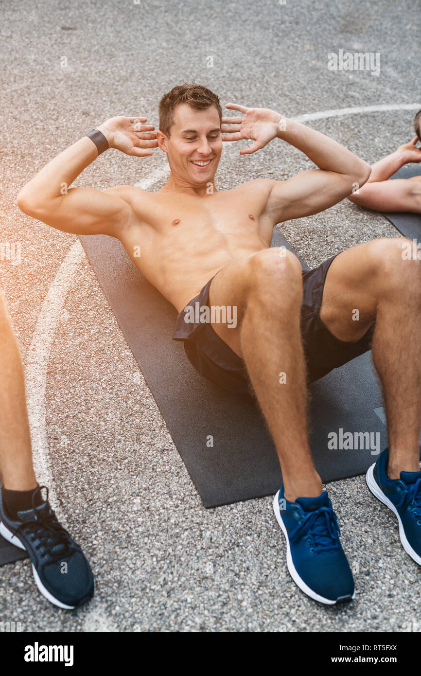 Sportive man doing sit-up Stock Photo