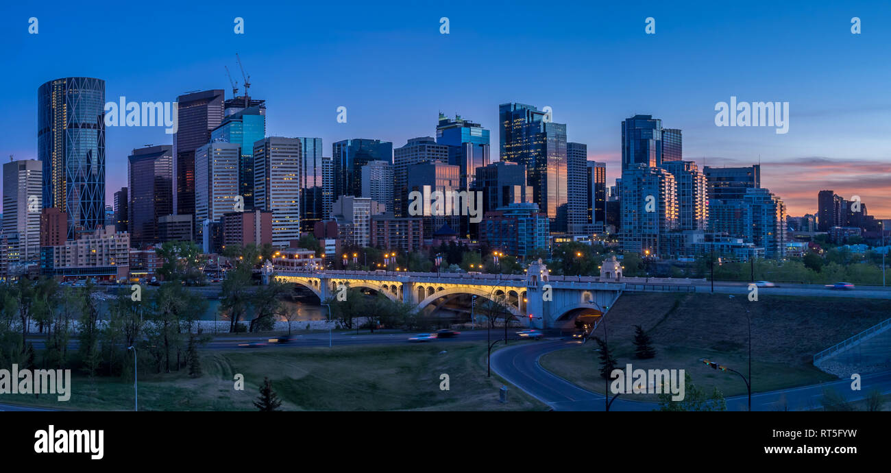 Calgary skyline at night with Bow River and Centre Street Bridge ...