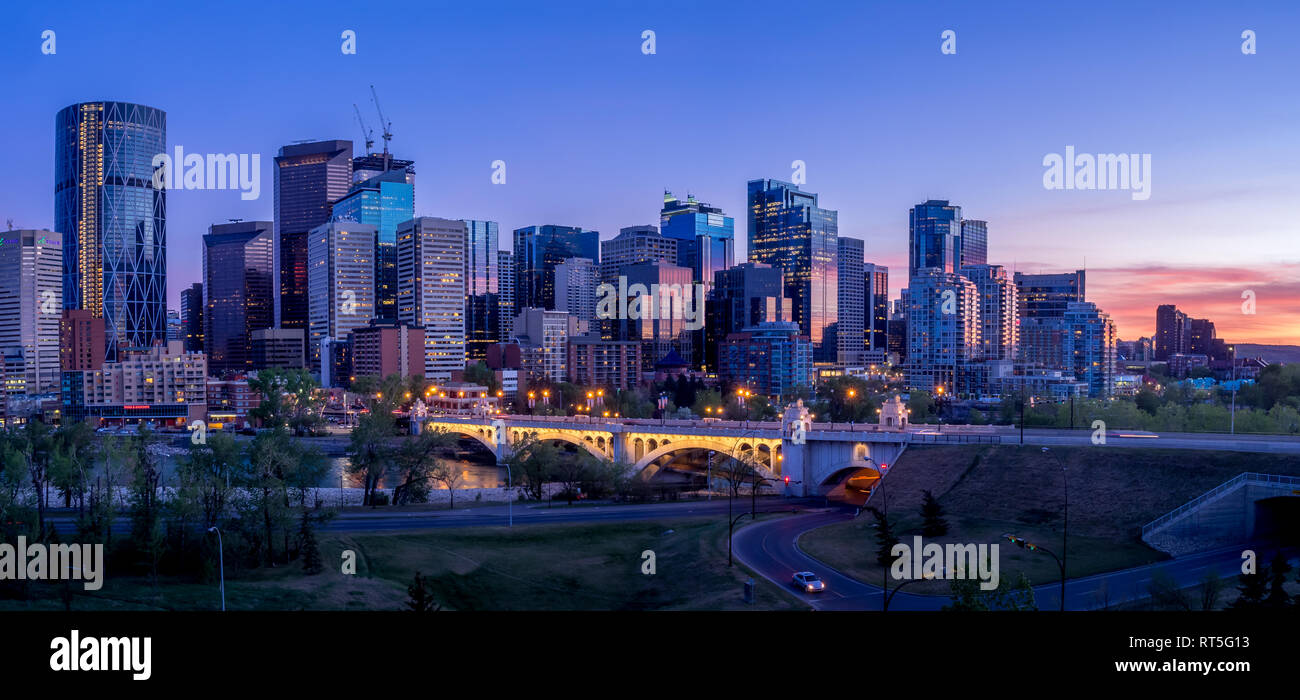 Calgary skyline at night with Bow River and Centre Street Bridge ...