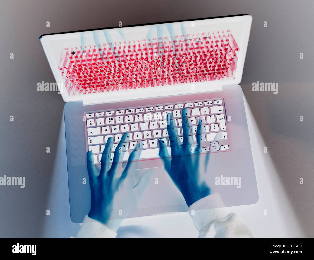 Hands of hacker coding computer virus on laptop Stock Photo