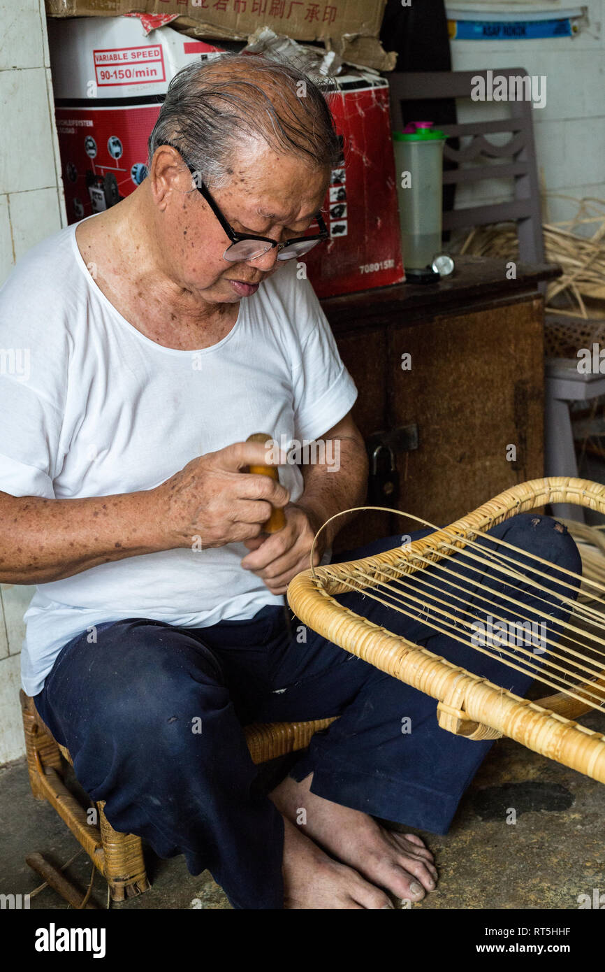 Craftsman Making a Chair in his Workshop, George Town, Penang, Malaysia Stock Photo