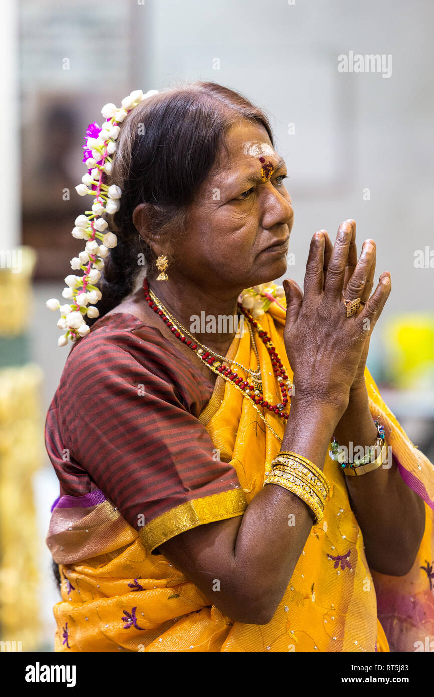 Hindu Temple, Sri Maha Mariamman, Woman Praying during Navarathri Celebrations, George Town, Penang, Malaysia. Stock Photo