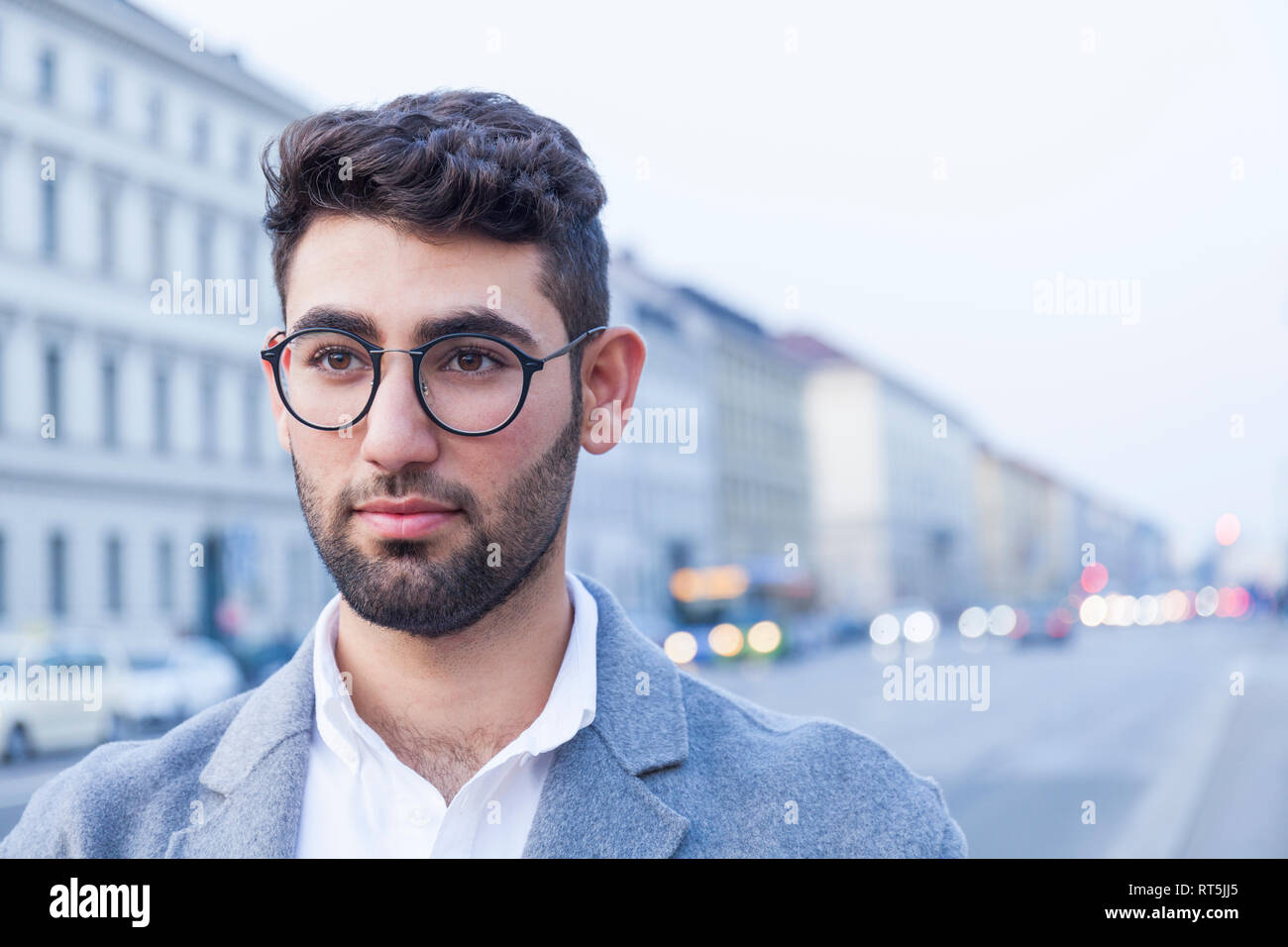 Portrait of bearded young businessman wearing glasses Stock Photo