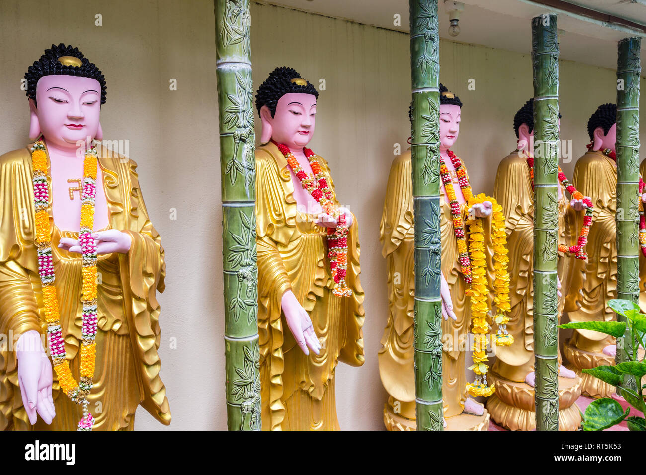 Buddhist Statues in Wall Surrounding garden of Kek Lok Si Buddhist Temple, George Town, Penang, Malaysia. Stock Photo