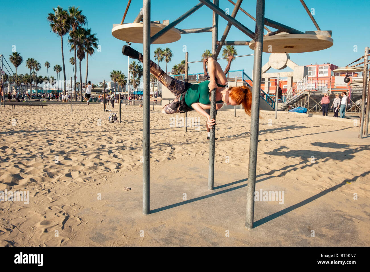 USA, California, Los Angeles, Venice, Musle Beach, sporty woman on pole, poledance Stock Photo