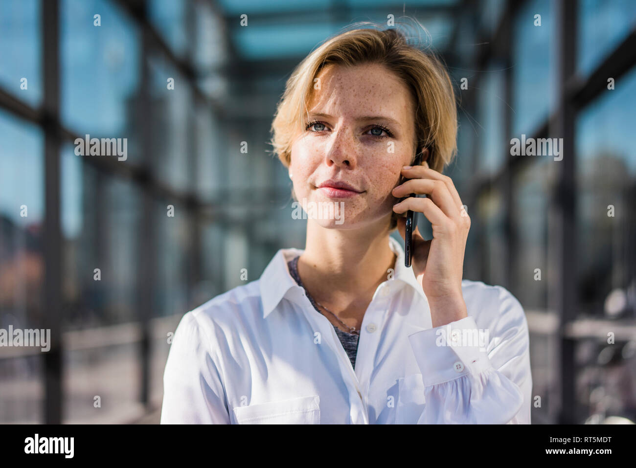 Young businesswoman using mobile phone Stock Photo