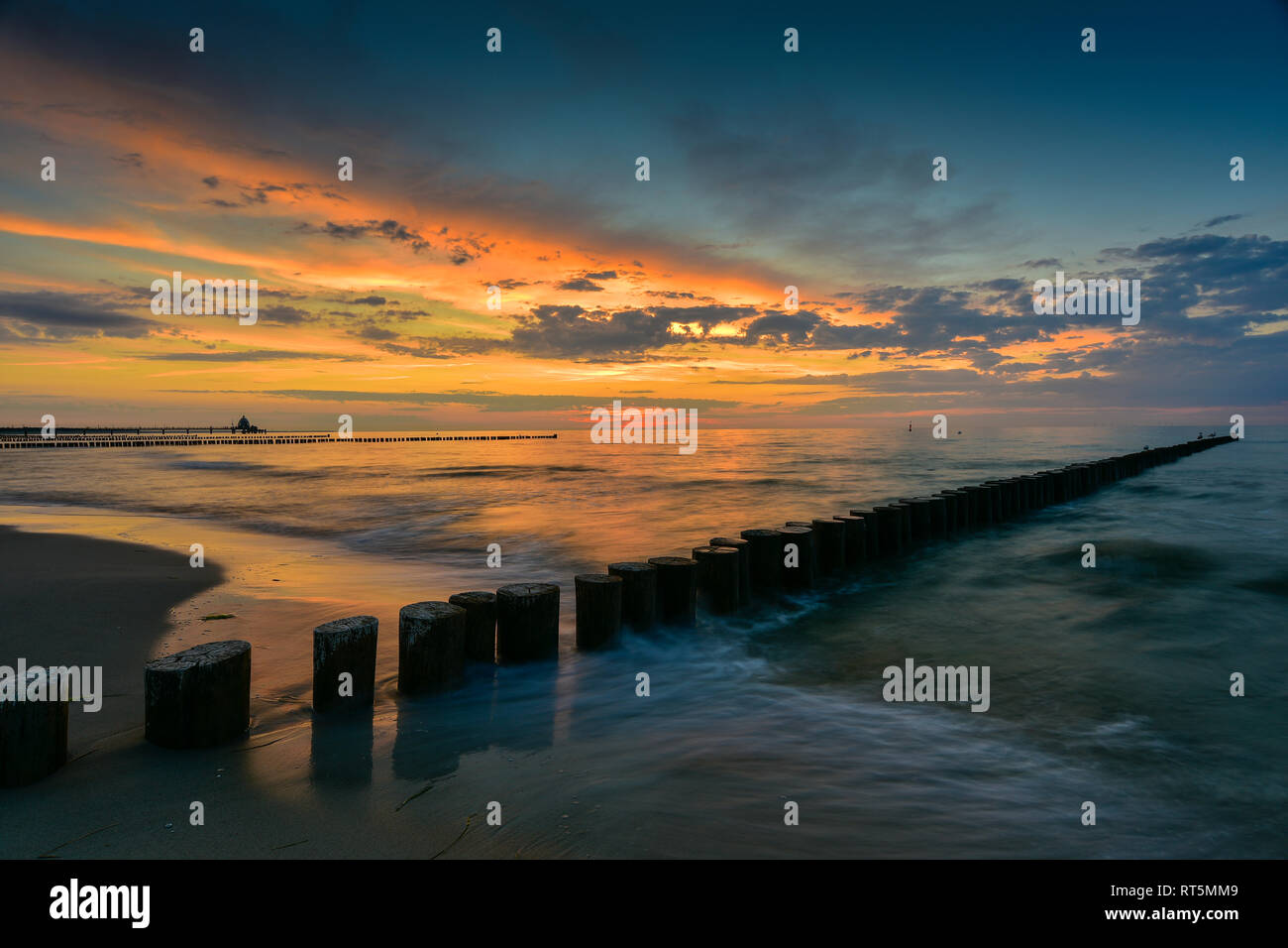 Germany, Mecklenburg-Western Pomerania, Zingst, beach and breakwater at sunset Stock Photo