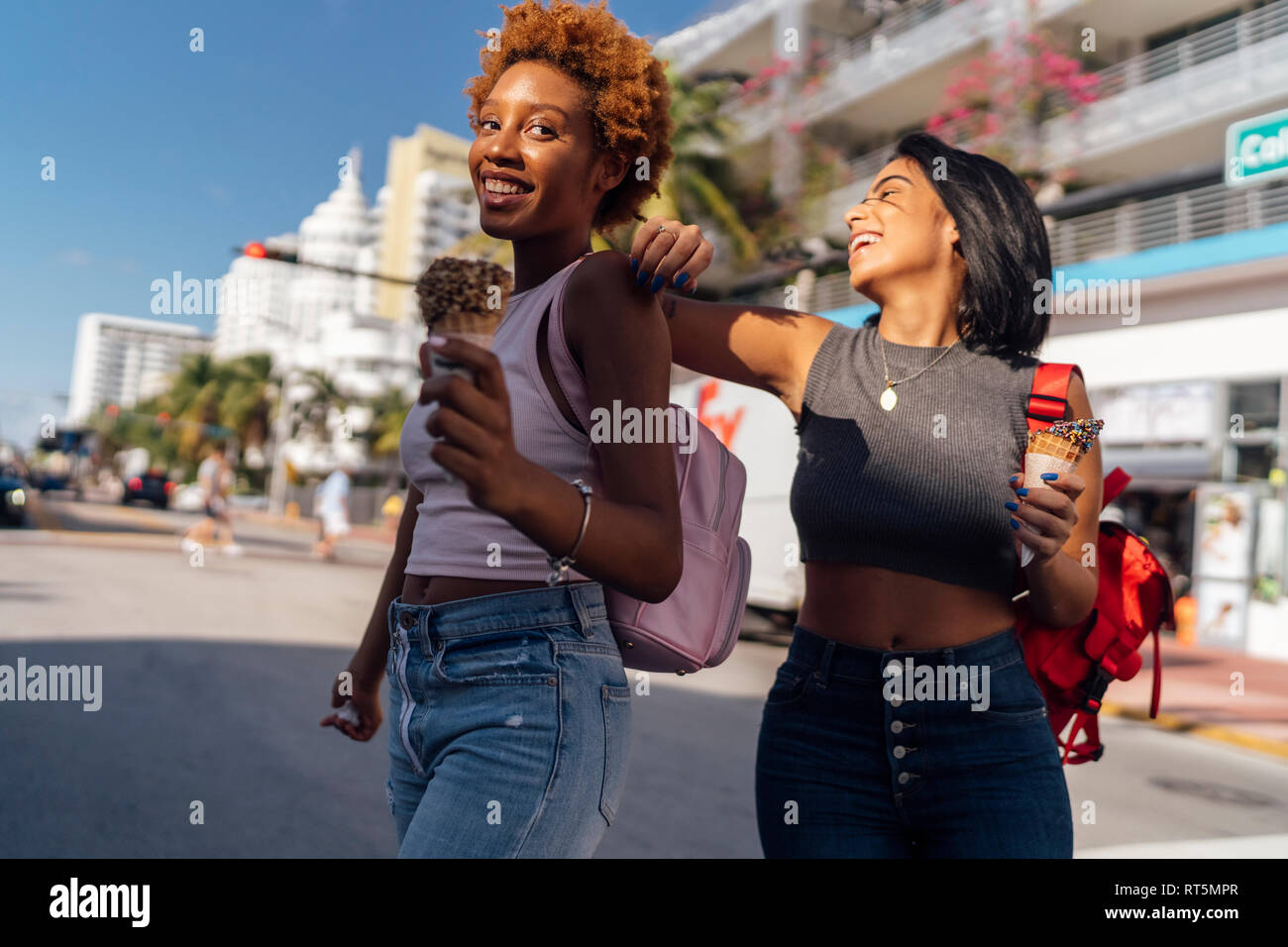 USA, Florida, Miami Beach, two happy female friends with ice cream