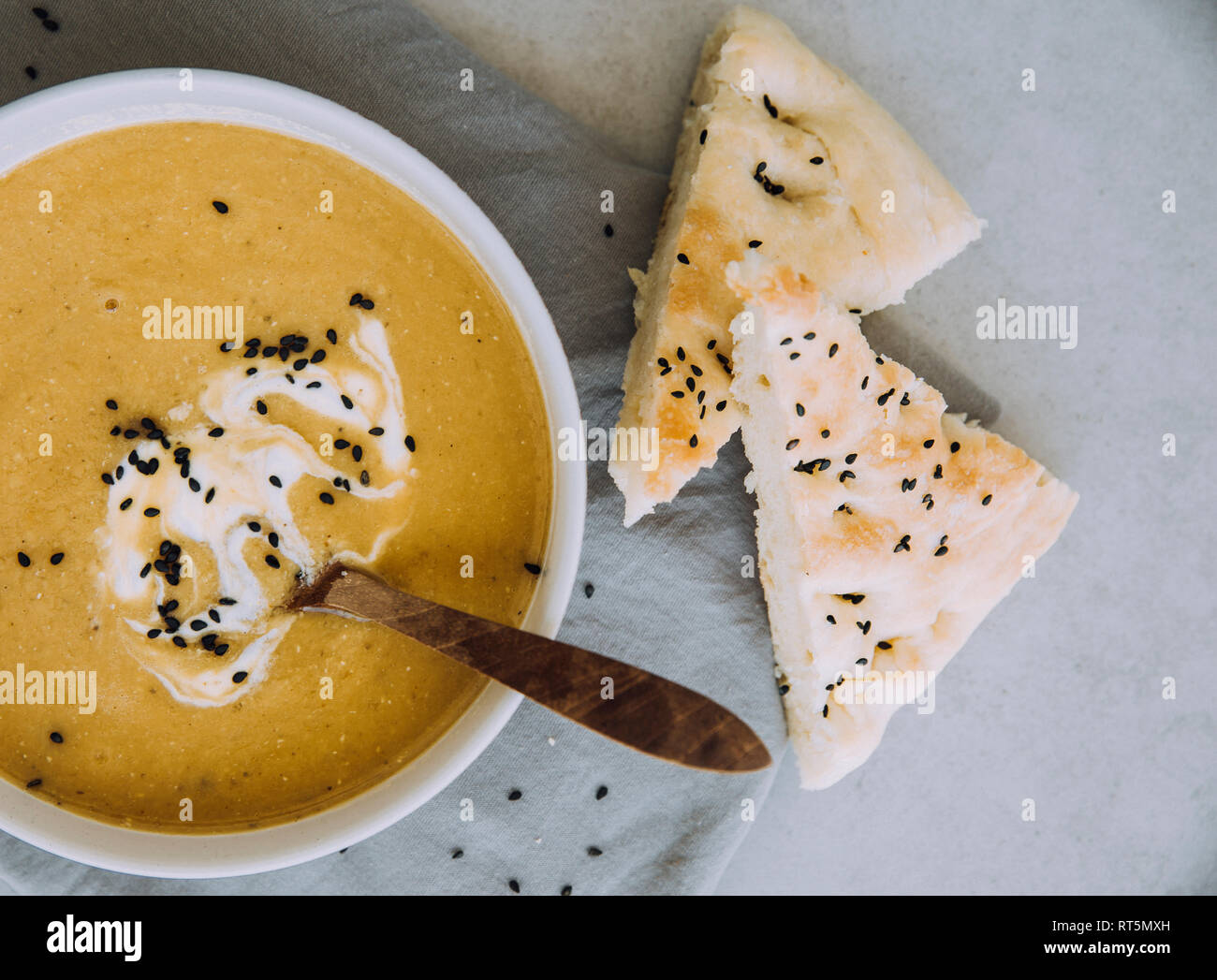 Lentil soup with sweet potato and bread, from above Stock Photo