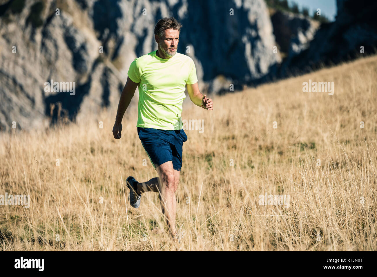 Austria, Tyrol, man running in the mountains Stock Photo