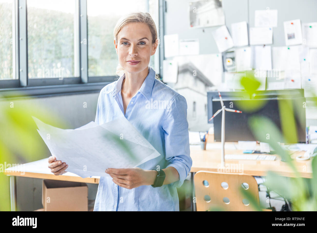 Portrait of confident woman in office Stock Photo