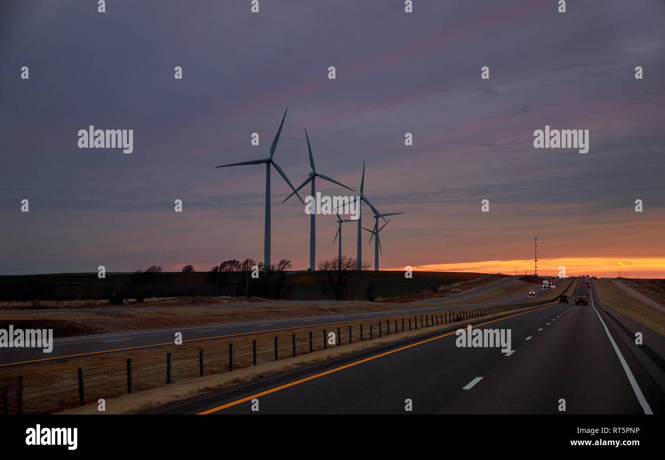 A wind farm at sunset in Texas. Silhouette of wind turbines Stock Photo ...