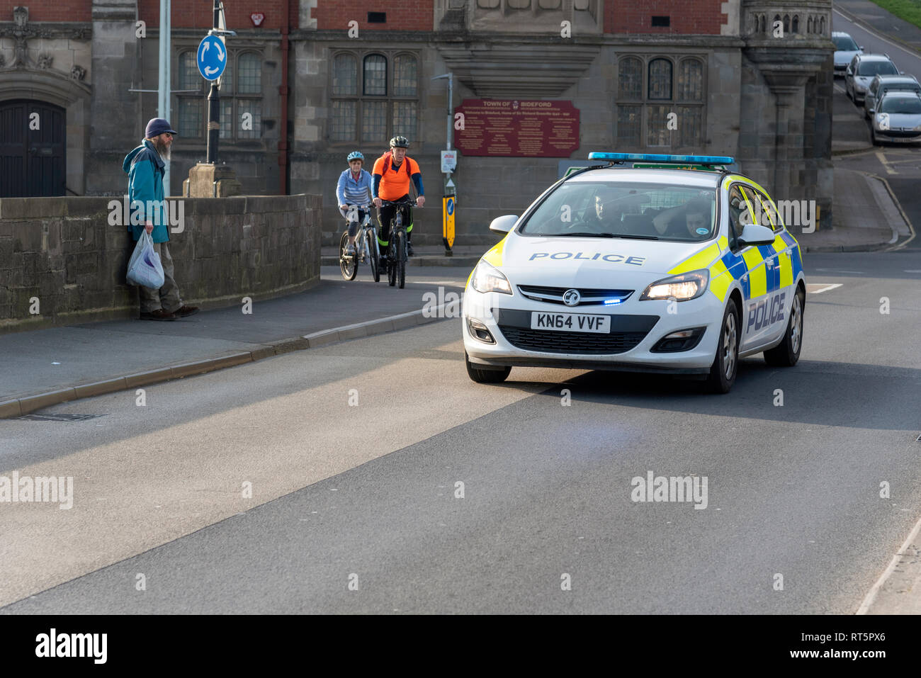 Bideford, North Devon, England, UK. February 2019. Police car on a blue light  with two officers onboard Stock Photo