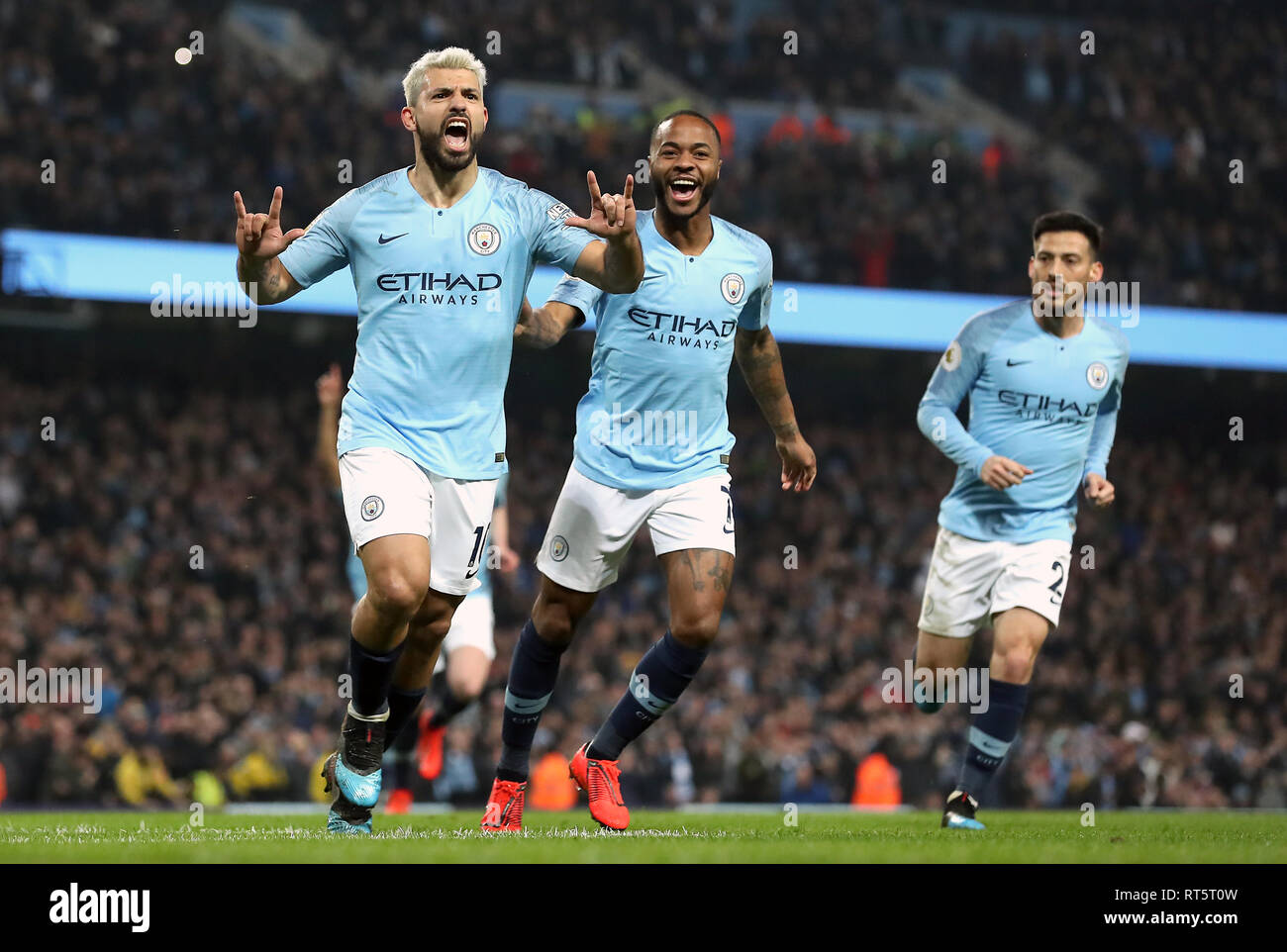 Manchester City S Sergio Aguero Celebrates Scoring His Side S First Goal Of The Game With Raheem Sterling Centre During The Premier League Match At The Etihad Stadium Manchester Stock Photo Alamy