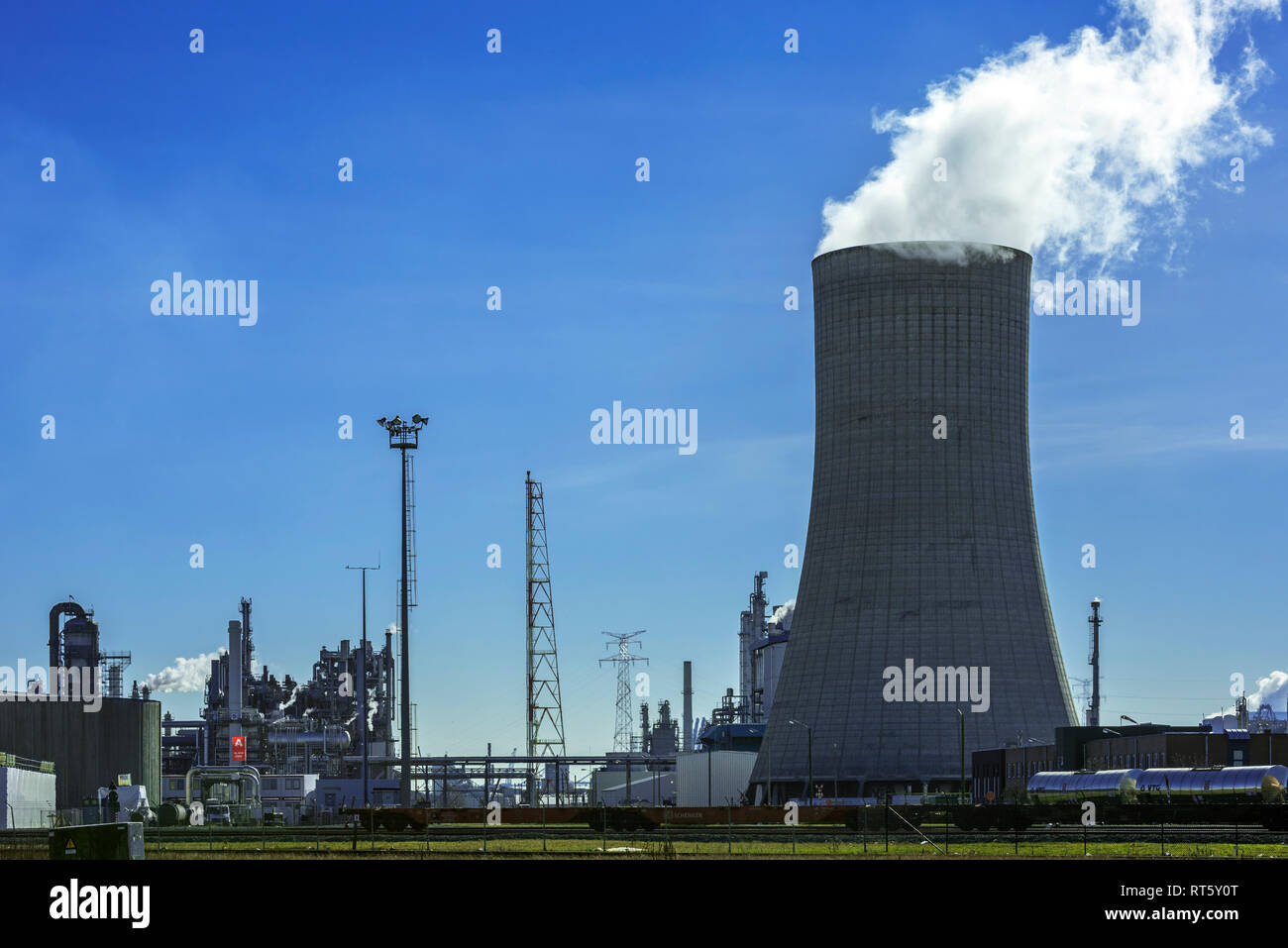 Industrial estate showing cooling tower of the BASF chemical production site in the port of Antwerp, Belgium Stock Photo