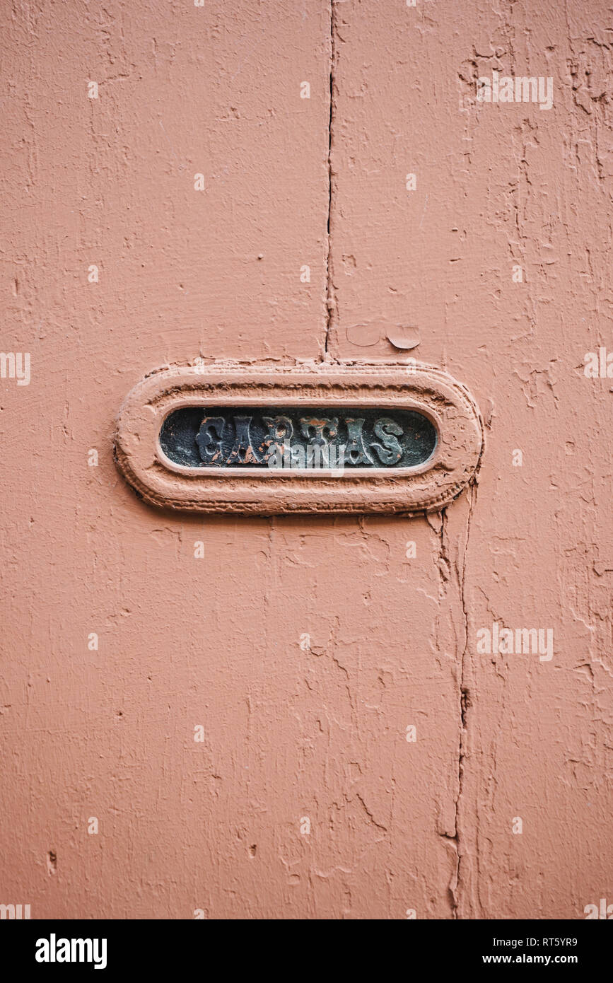 Vintage Portuguese Mail Slot with beautiful lettering, in wooden door with cracked and peeling