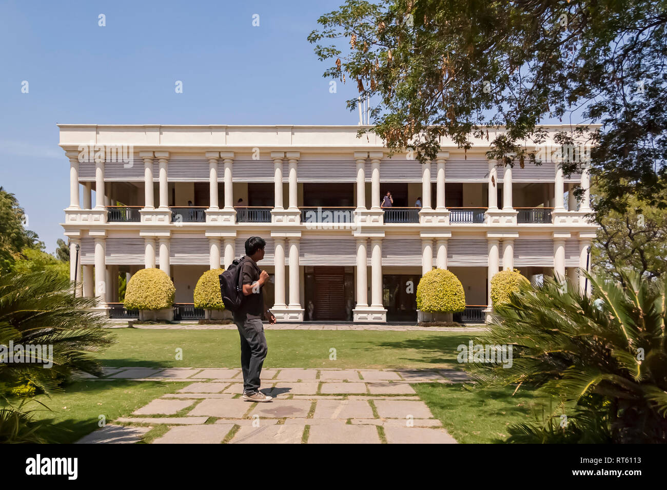 The Sagar Mahal Complex at the Golkonda Resorts and Spa, Hyderabad, Telangana, India. A guest walking around the property on a bright sunny day. Stock Photo