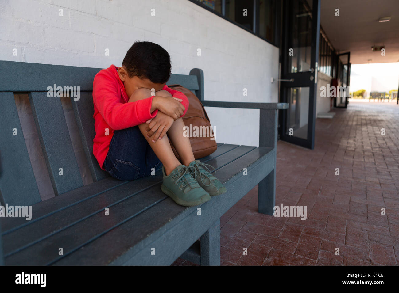 Sad student sitting on bench hi-res stock photography and images - Alamy