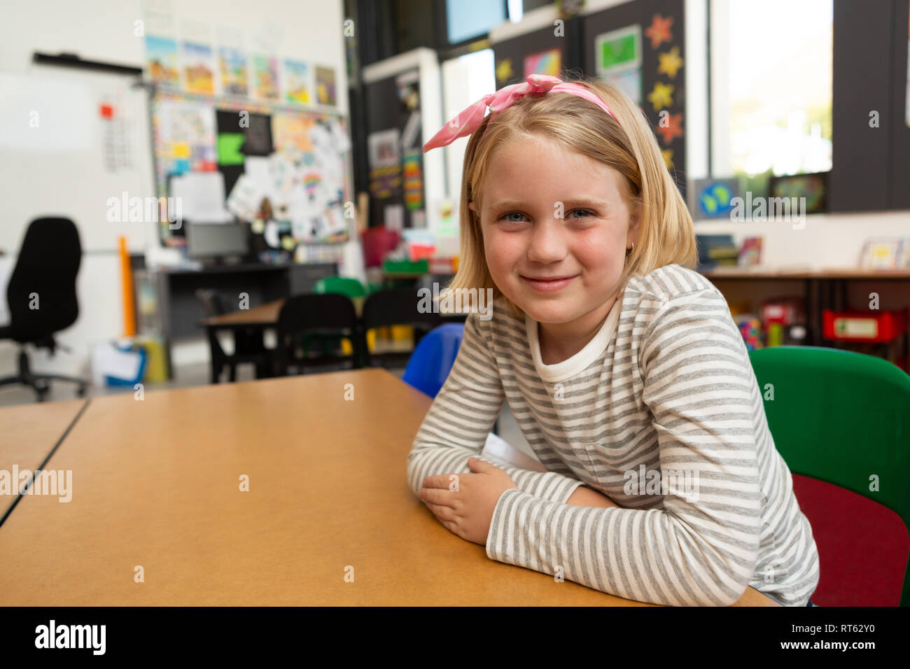 Schoolgirl sitting in the classroom at school Stock Photo - Alamy