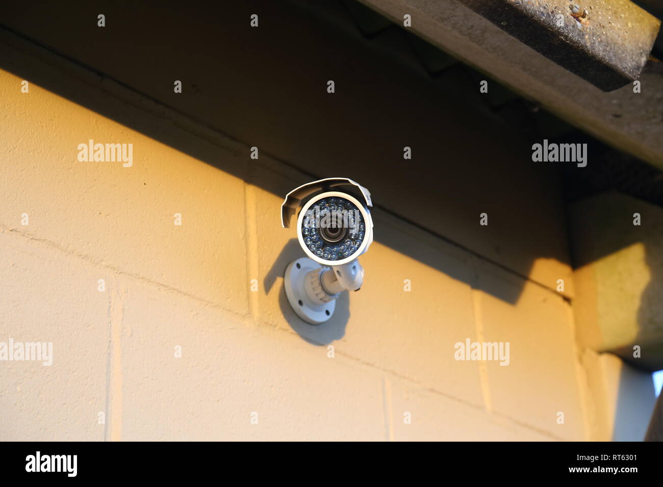 Security camera mounted on wall Stock Photo