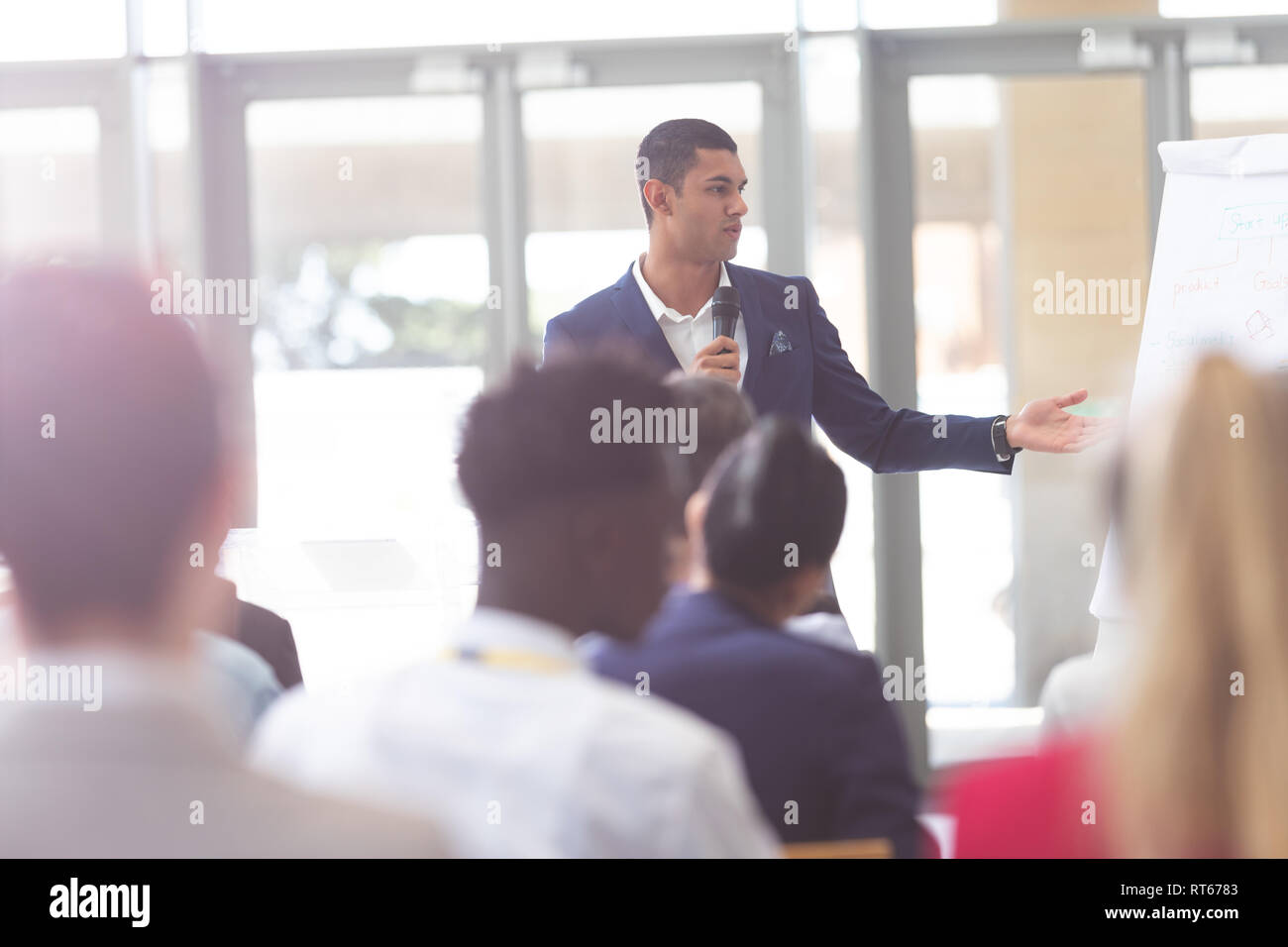 Businessman speaking in business seminar at conference Stock Photo