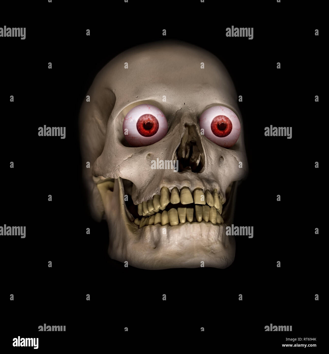 A scary human skulls with red eyes on a black background Stock Photo - Alamy
