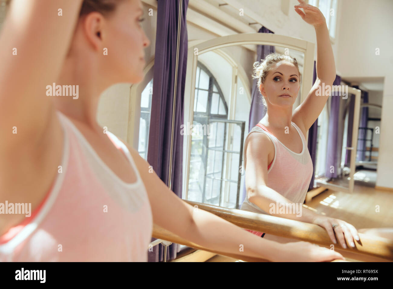 Ballet dancer training in dance studio Stock Photo