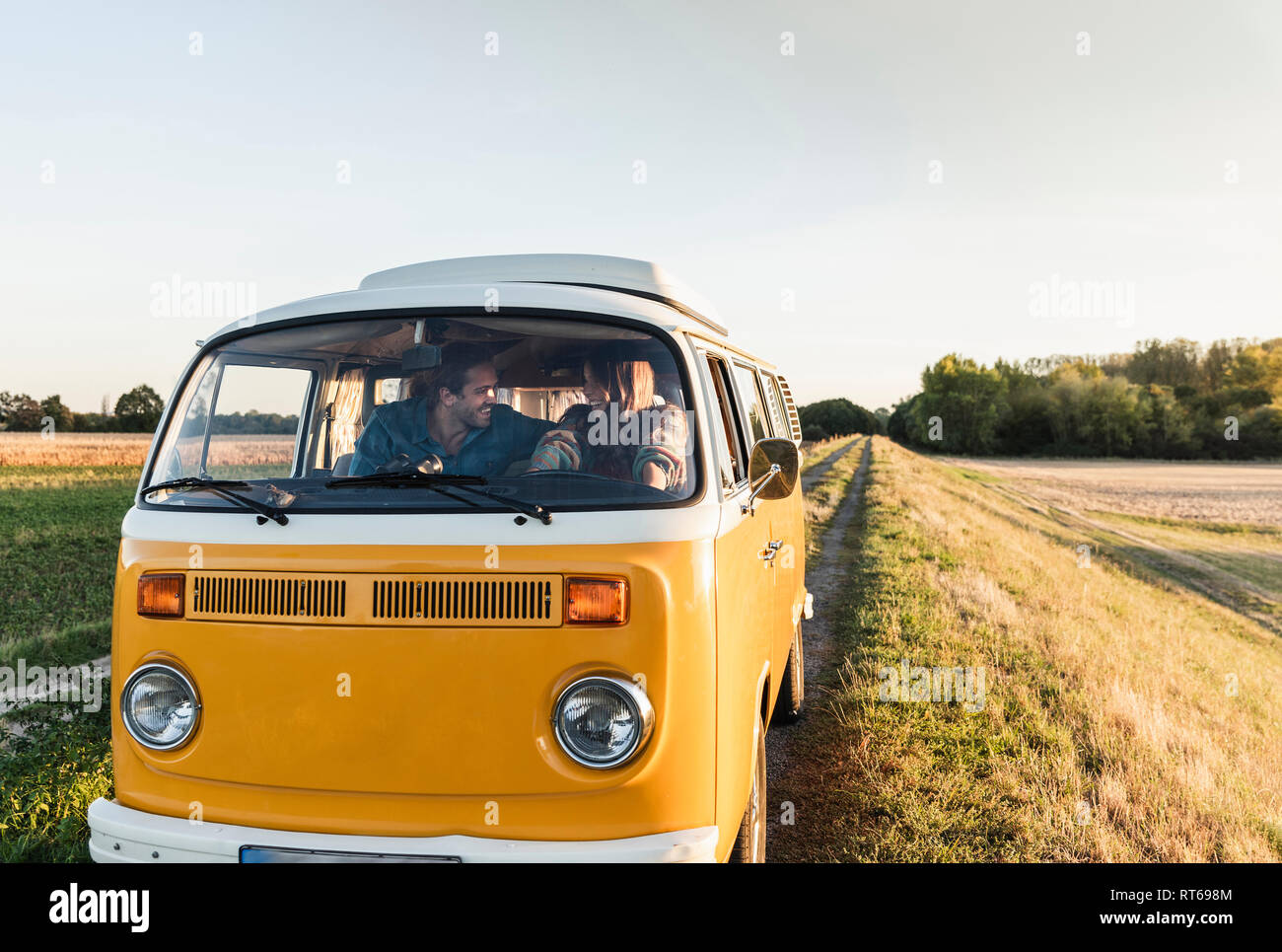 Young couple doing a road trip in their camper Stock Photo